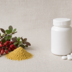 Conceptual still life with a barberry branch and yellow root powder on the left and a plain unlabeled white tablet bottle with white pills on the right