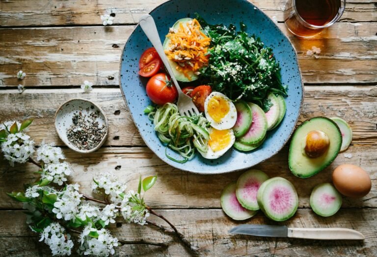 Fresh green apples and magnesium supplement capsules on a light wooden table with soft natural light